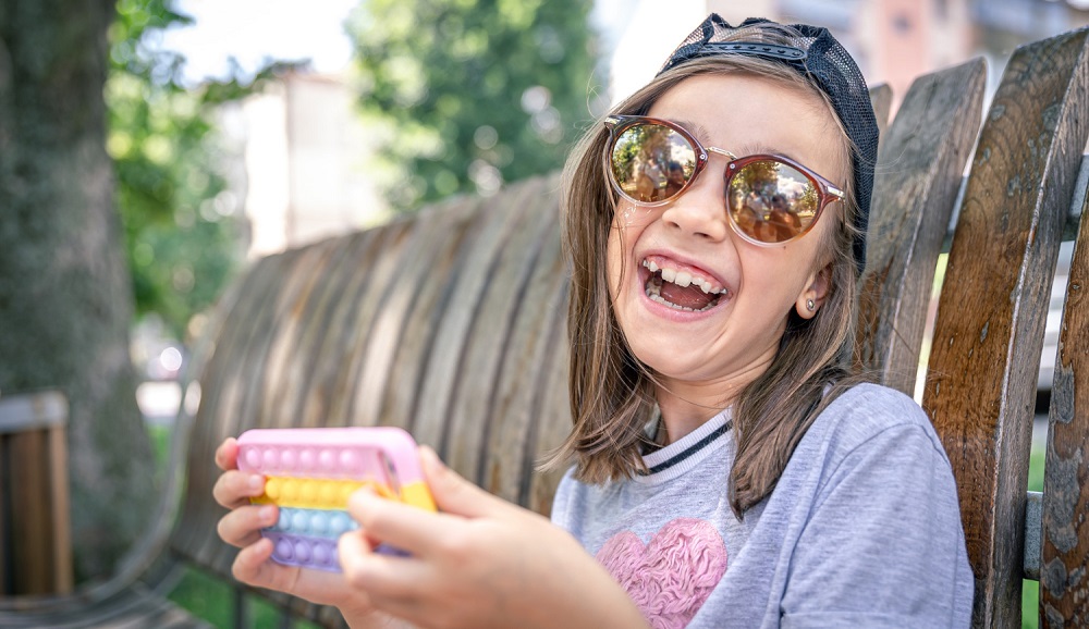 Photograph of smiling young lady wearing glasses